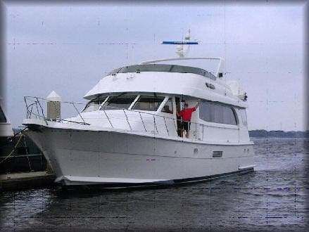 A man standing on the side of a boat.